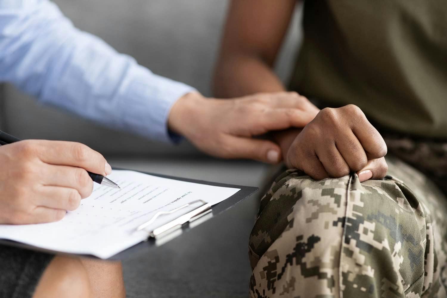 A soldier getting comforted.